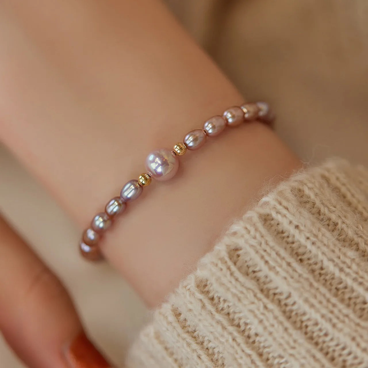 Pearl bracelet on a wrist with a blurred background